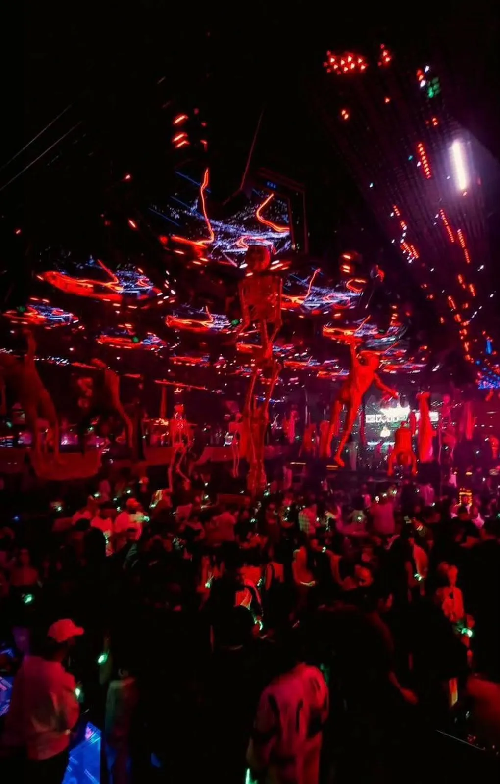 Costumed dancers and thematic stage decorations during an evening party
